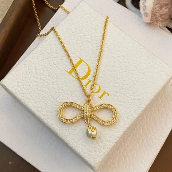 Dazzling and flawless golden bow - Picture 2 of 4